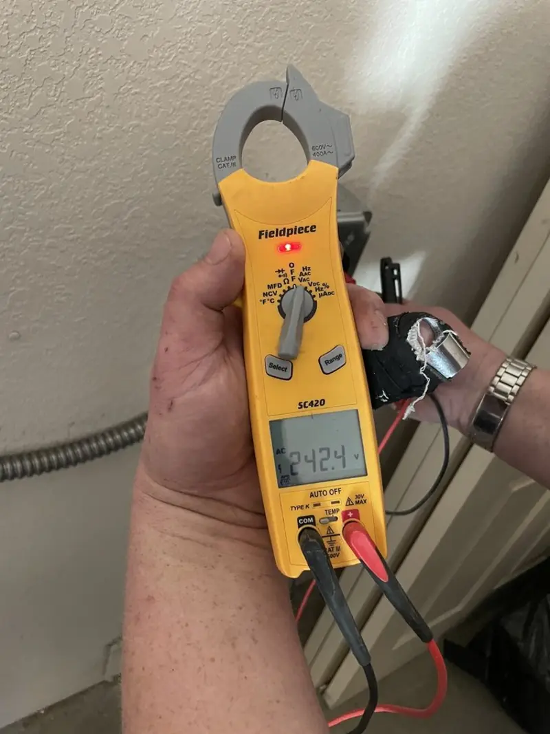 Voltage testing with clamp meter during Whole House Surge Protector in Kingsford
